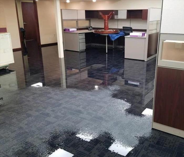 Commercial building suffering from water damage with flooded floors 
